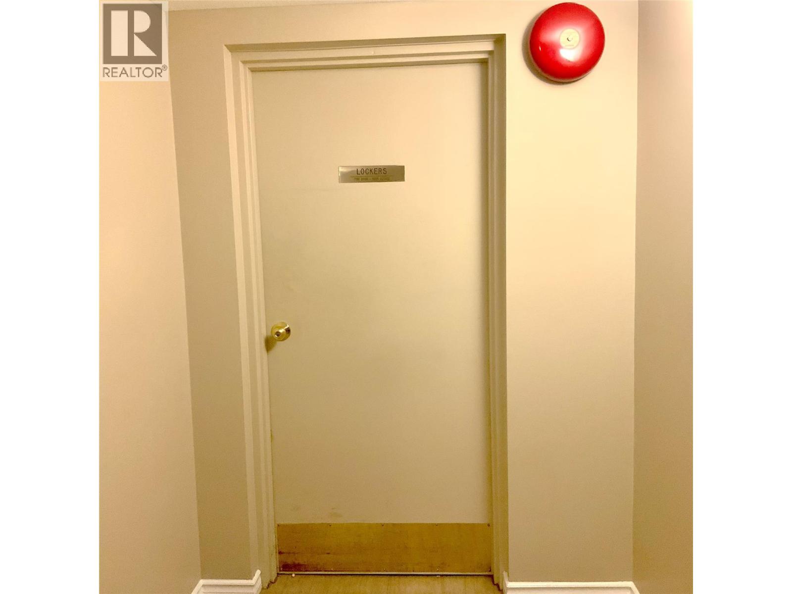 door to locker room in parkade level - 3300 Centennial Drive Unit# 411, Vernon, BC - Indoor Photo Showing Other Room