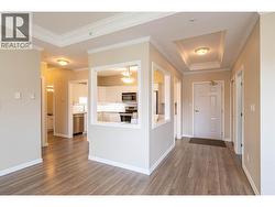 looking at the Kitchen and entry area from the living room -