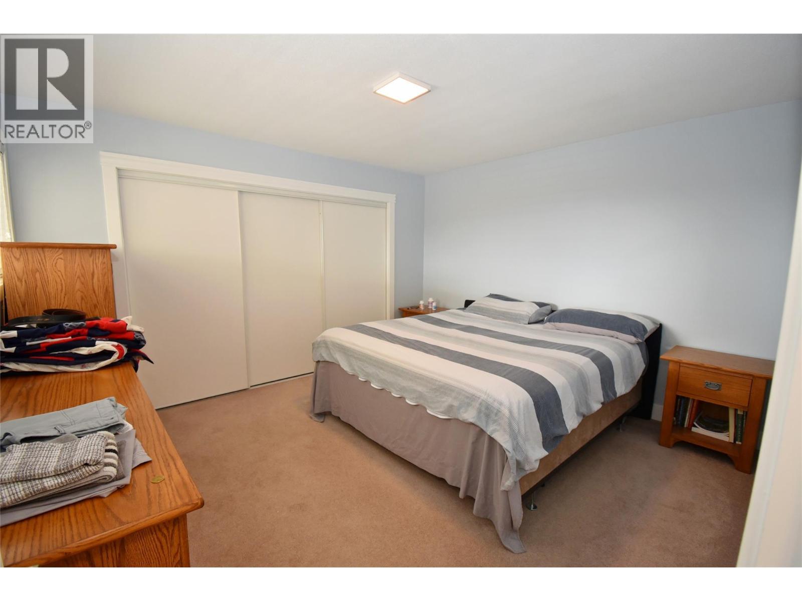 Primary bedroom - 6427 Spencer Road, Kelowna, BC - Indoor Photo Showing Bedroom