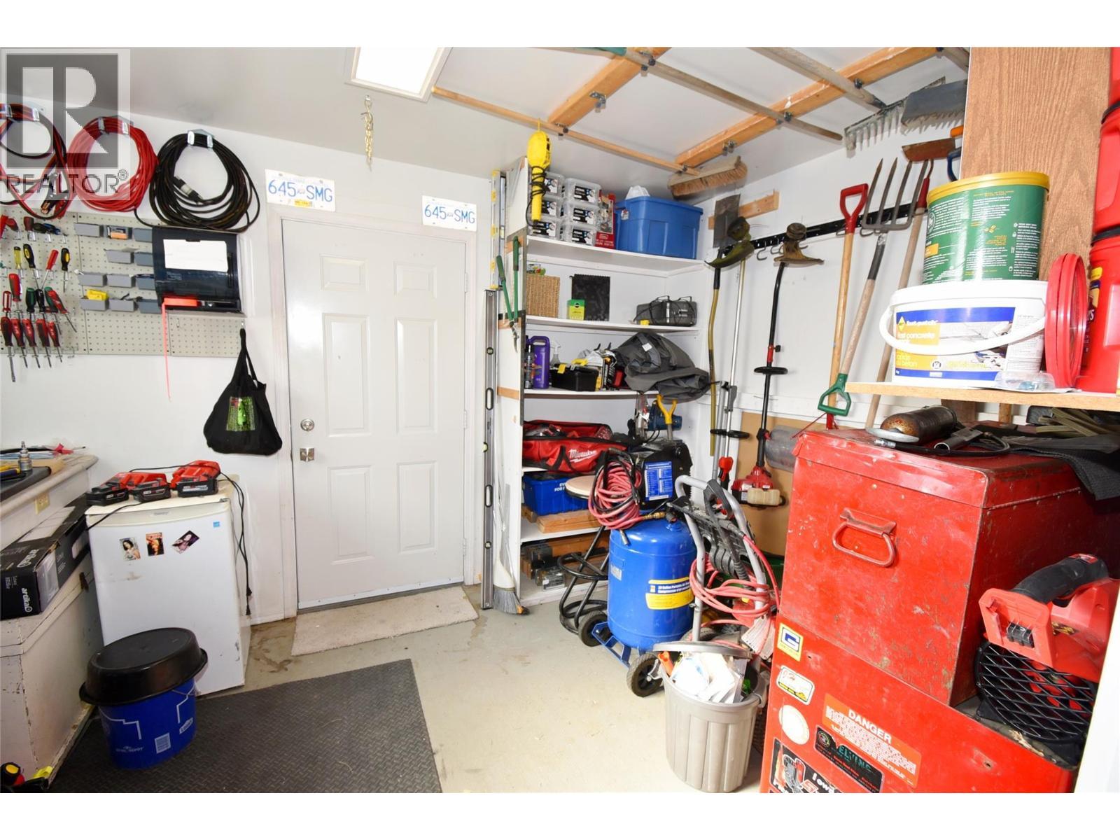 Workshop in the basement - 6427 Spencer Road, Kelowna, BC - Indoor Photo Showing Garage