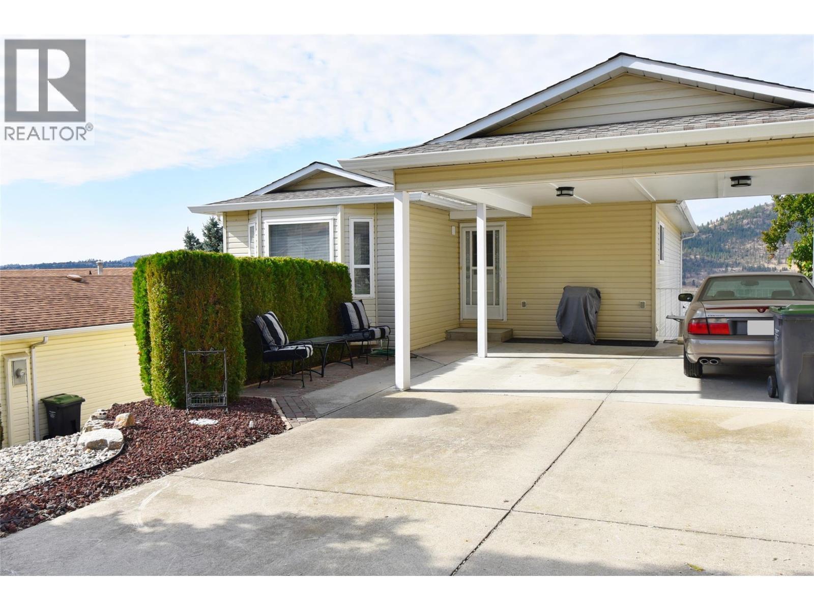 Carport parking for 2 vehicles - 6427 Spencer Road, Kelowna, BC - Outdoor