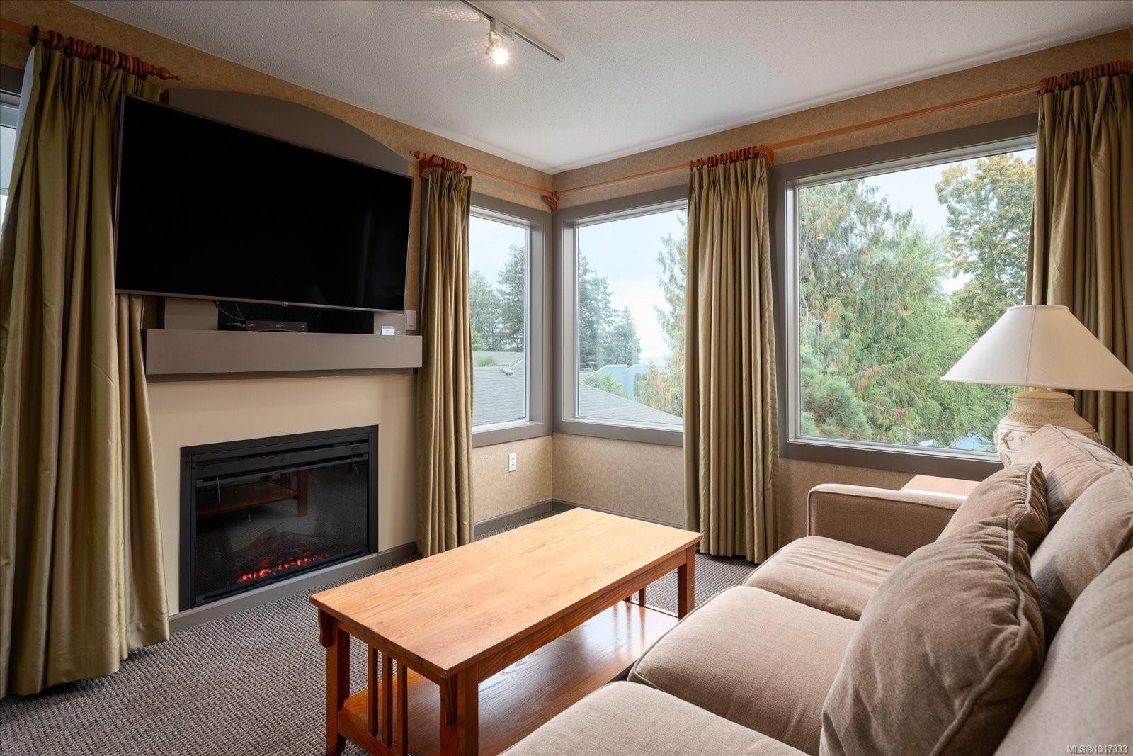 720-1600 Stroulger Rd, Nanoose Bay, BC - Indoor Photo Showing Living Room With Fireplace