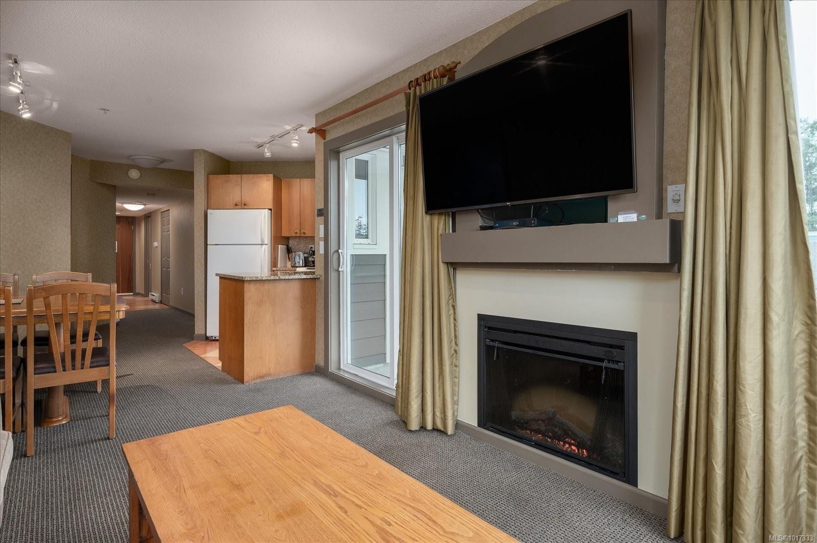 720-1600 Stroulger Rd, Nanoose Bay, BC - Indoor Photo Showing Living Room With Fireplace