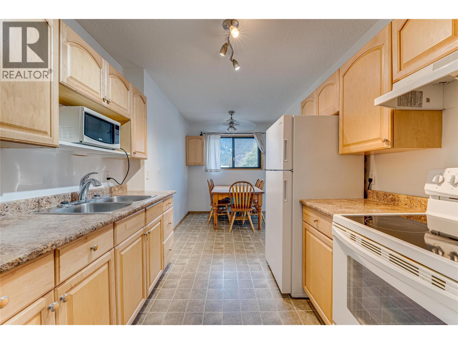 409 Main Street Unit# 206, Sicamous, BC - Indoor Photo Showing Kitchen With Double Sink