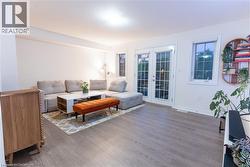 Living area featuring french doors and wood finished floors -