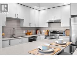 Kitchen- Photos are of a similar home; some features may vary -