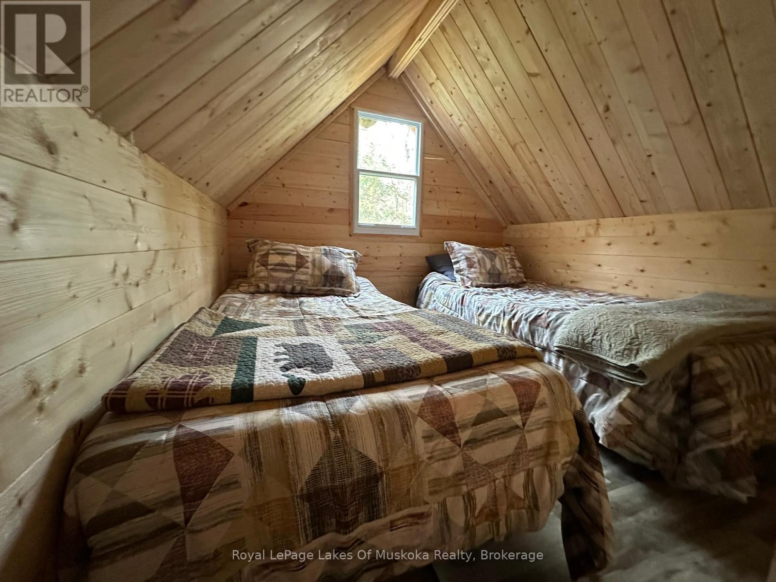 Sleeping Area - 77 Grindstone Road, Magnetawan, ON - Indoor Photo Showing Bedroom