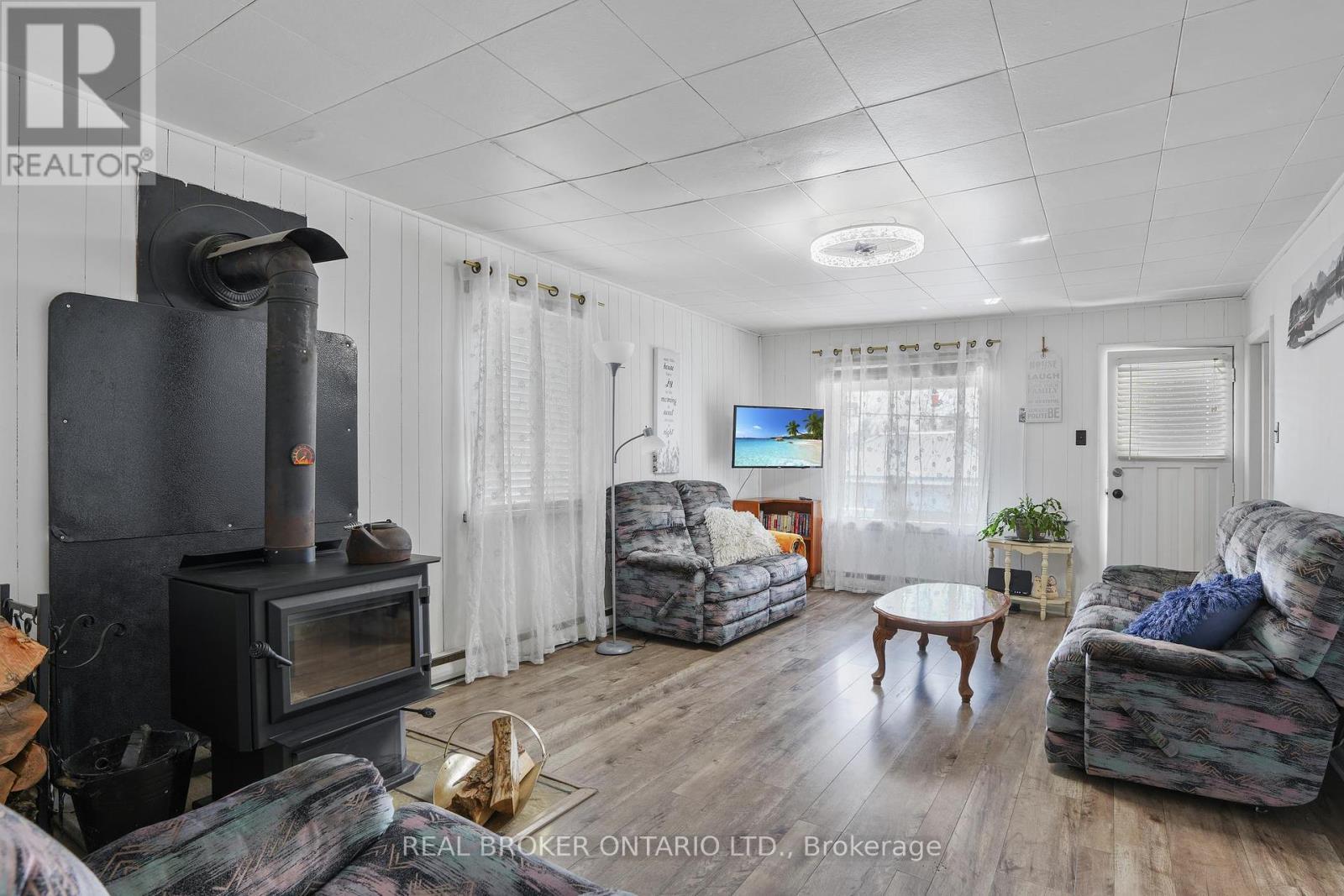 79 & 85 Bridge Street, Addington Highlands, ON - Indoor Photo Showing Living Room With Fireplace