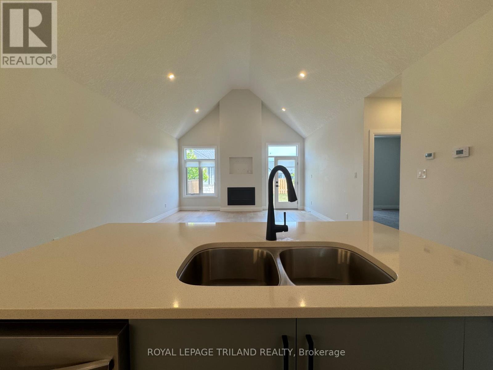 49 - 63 Compass Trail, Central Elgin, ON - Indoor Photo Showing Kitchen With Double Sink