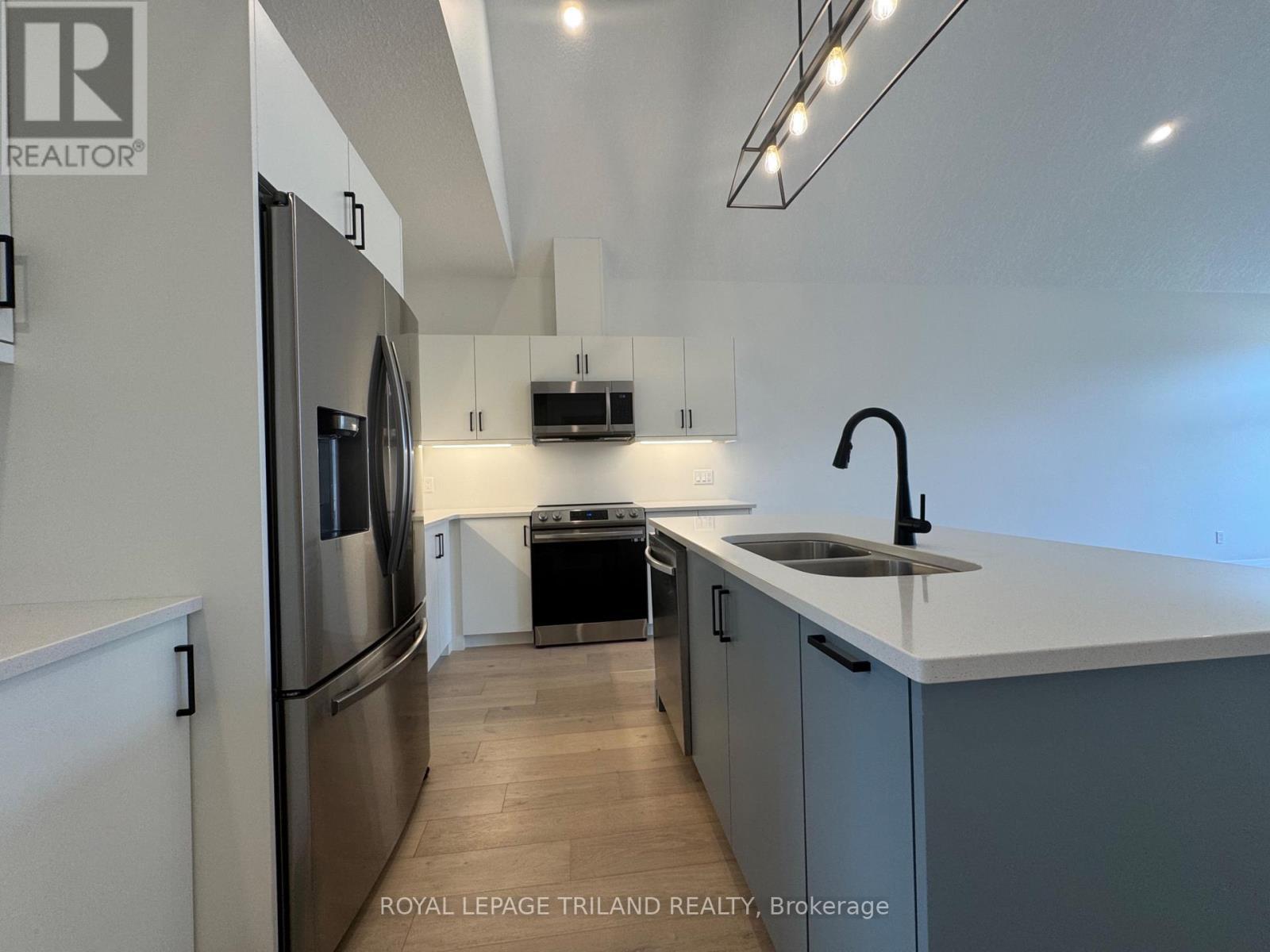 49 - 63 Compass Trail, Central Elgin, ON - Indoor Photo Showing Kitchen With Double Sink With Upgraded Kitchen