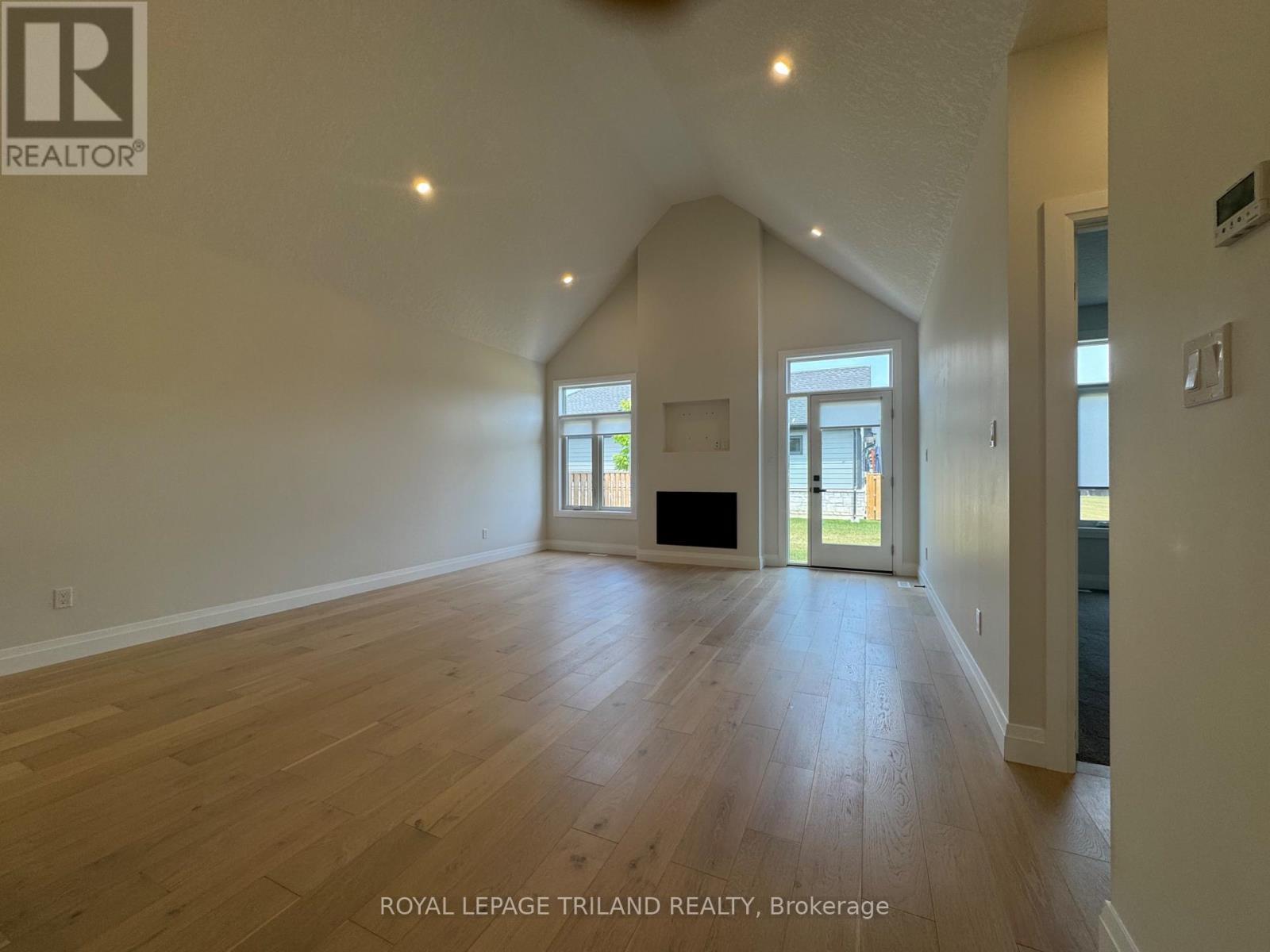 49 - 63 Compass Trail, Central Elgin, ON - Indoor With Fireplace