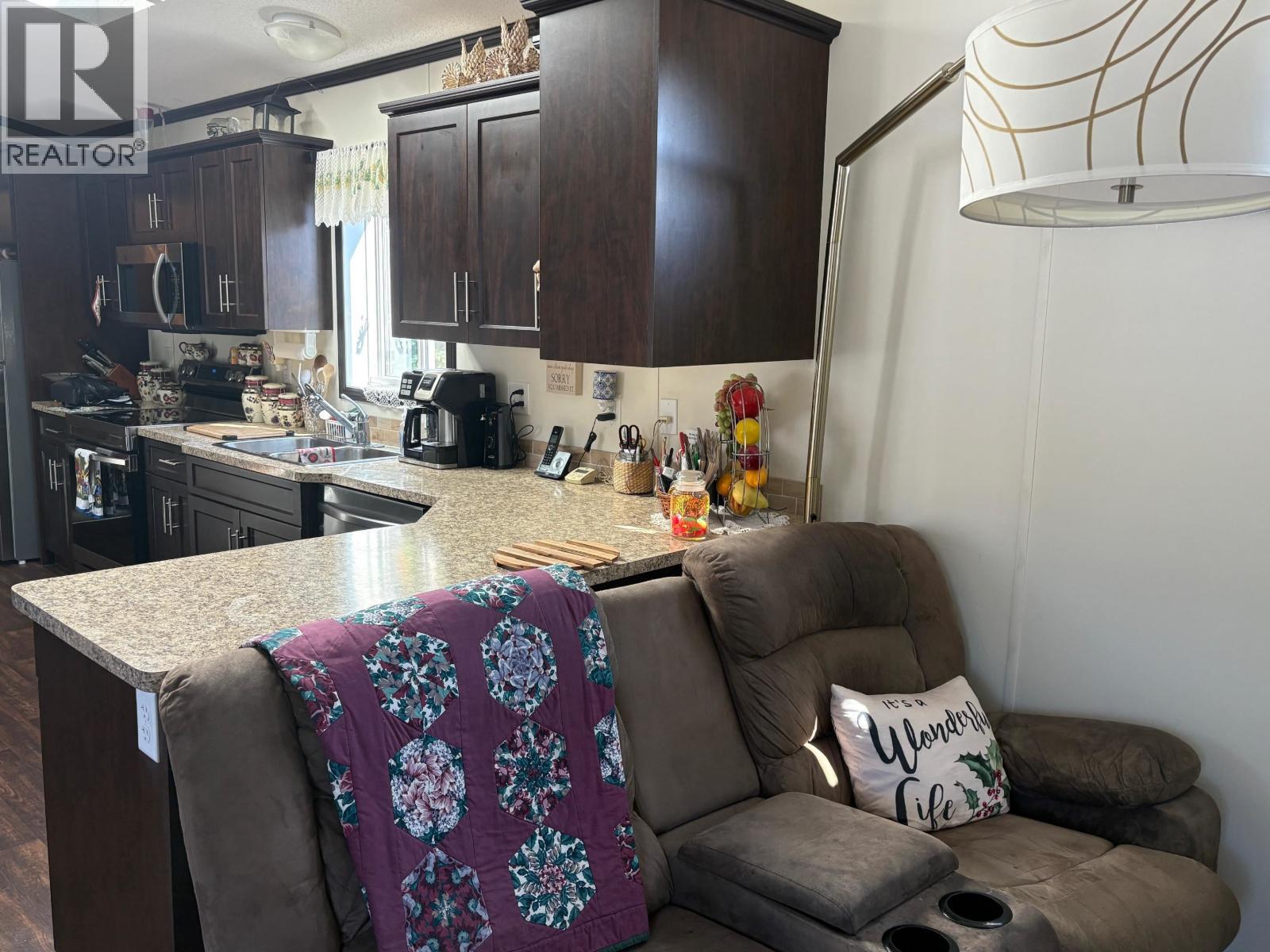 54 208 8Th Street, 100 Mile House, BC - Indoor Photo Showing Kitchen With Double Sink