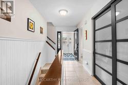 foyer with large double closet stairs up and down -