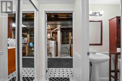 lower level hall with closet to laundry room -