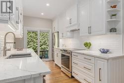 Patio doors to cedar deck's BBQ gas hookup -