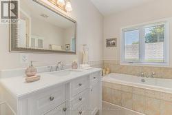 Sparkling upgraded 4-pc bathroom with soaker tub -