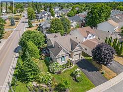 Lovely landscaped lot has mature trees for privacy -