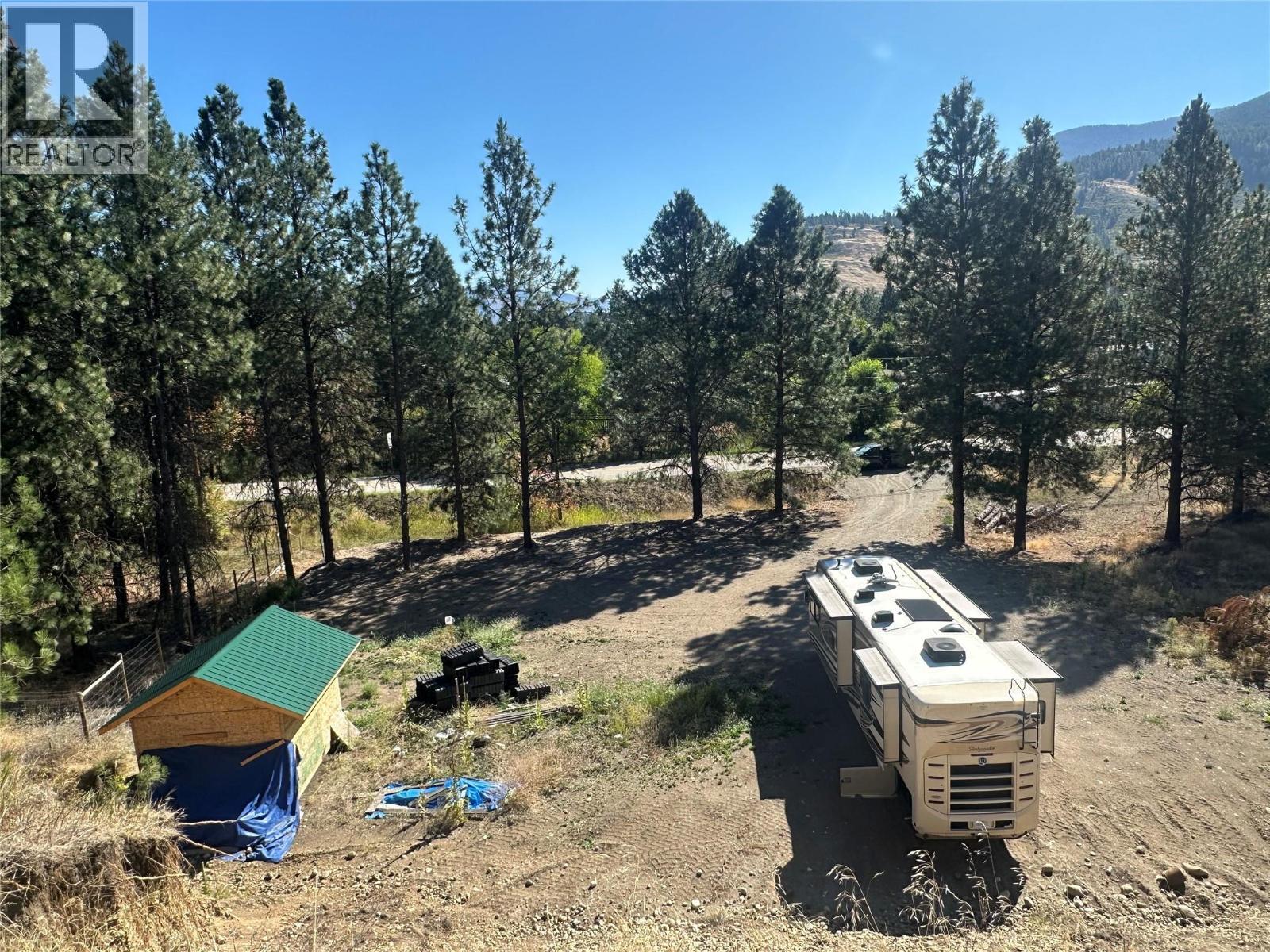Shed wired for electricity. Large Driveway. Levelled Lot, with 90 foot well and new septic field. - 5115 41 Highway, Grand Forks, BC