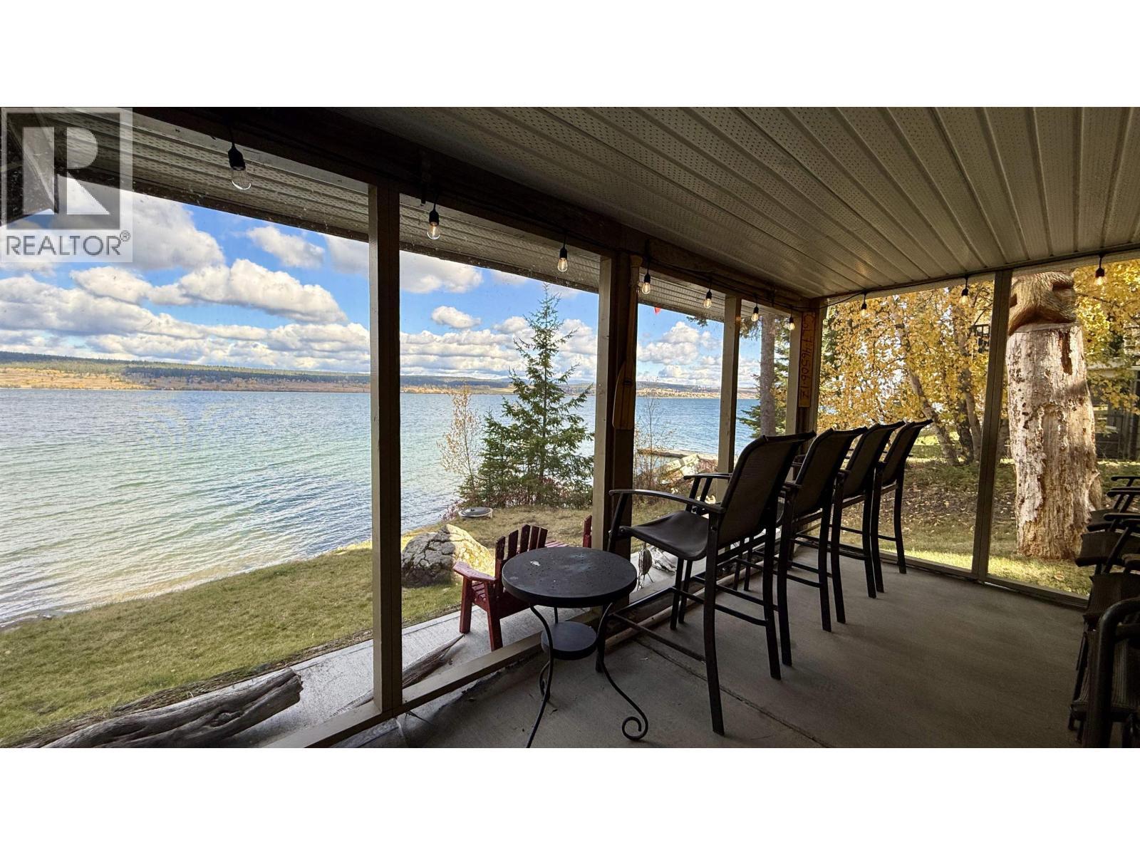 4635 Caverly Road, Lac La Hache, BC - Outdoor With Body Of Water With Deck Patio Veranda With View