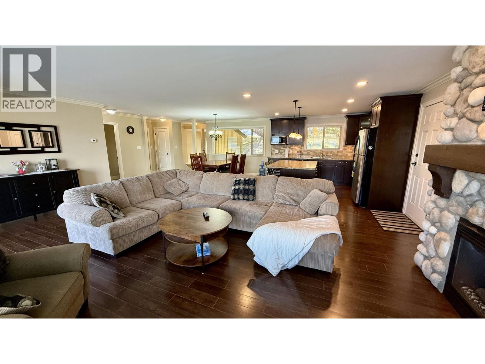 4635 Caverly Road, Lac La Hache, BC - Indoor Photo Showing Living Room With Fireplace
