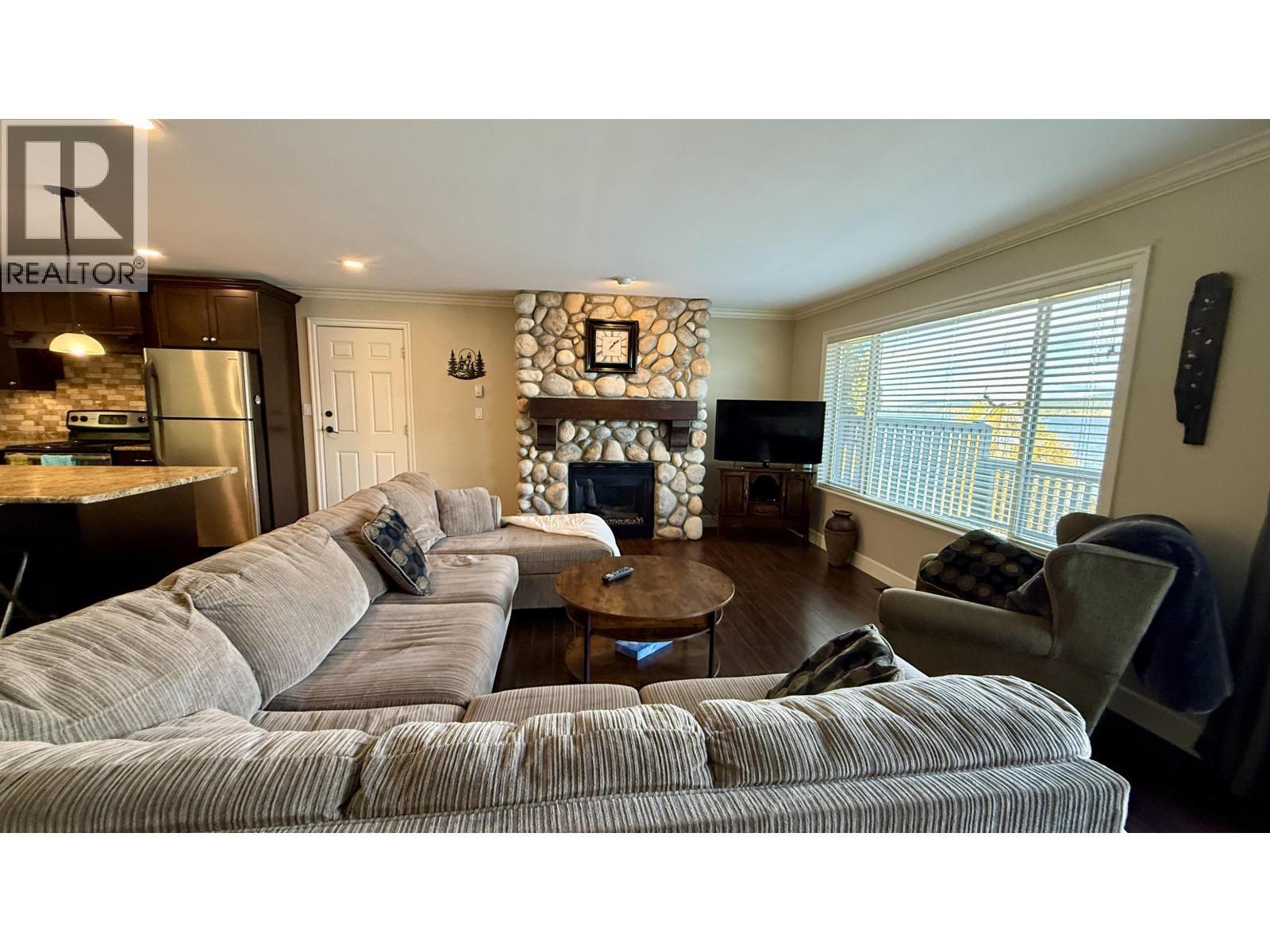 4635 Caverly Road, Lac La Hache, BC - Indoor Photo Showing Living Room With Fireplace