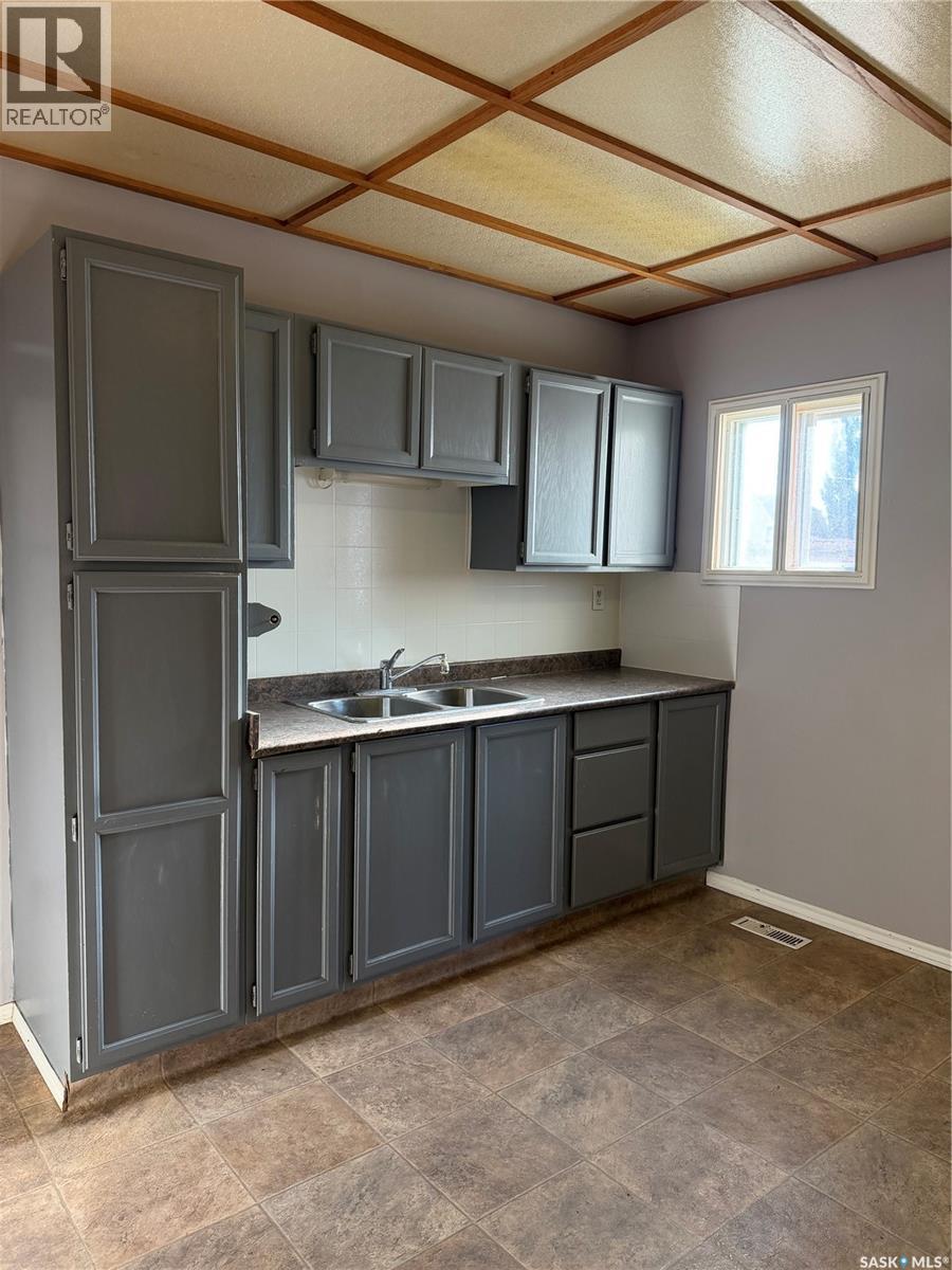 322 2Nd Avenue, Young, SK - Indoor Photo Showing Kitchen With Double Sink