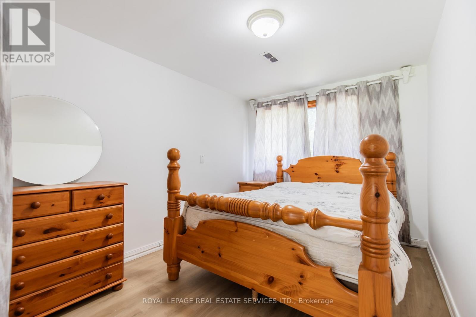 Bedroom on main level - Unit #2 - 227 Lakeshore Road W, Oakville, ON - Indoor Photo Showing Bedroom