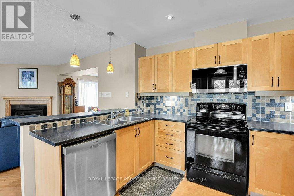 229 Mistral Way, Ottawa, ON - Indoor Photo Showing Kitchen With Fireplace With Double Sink