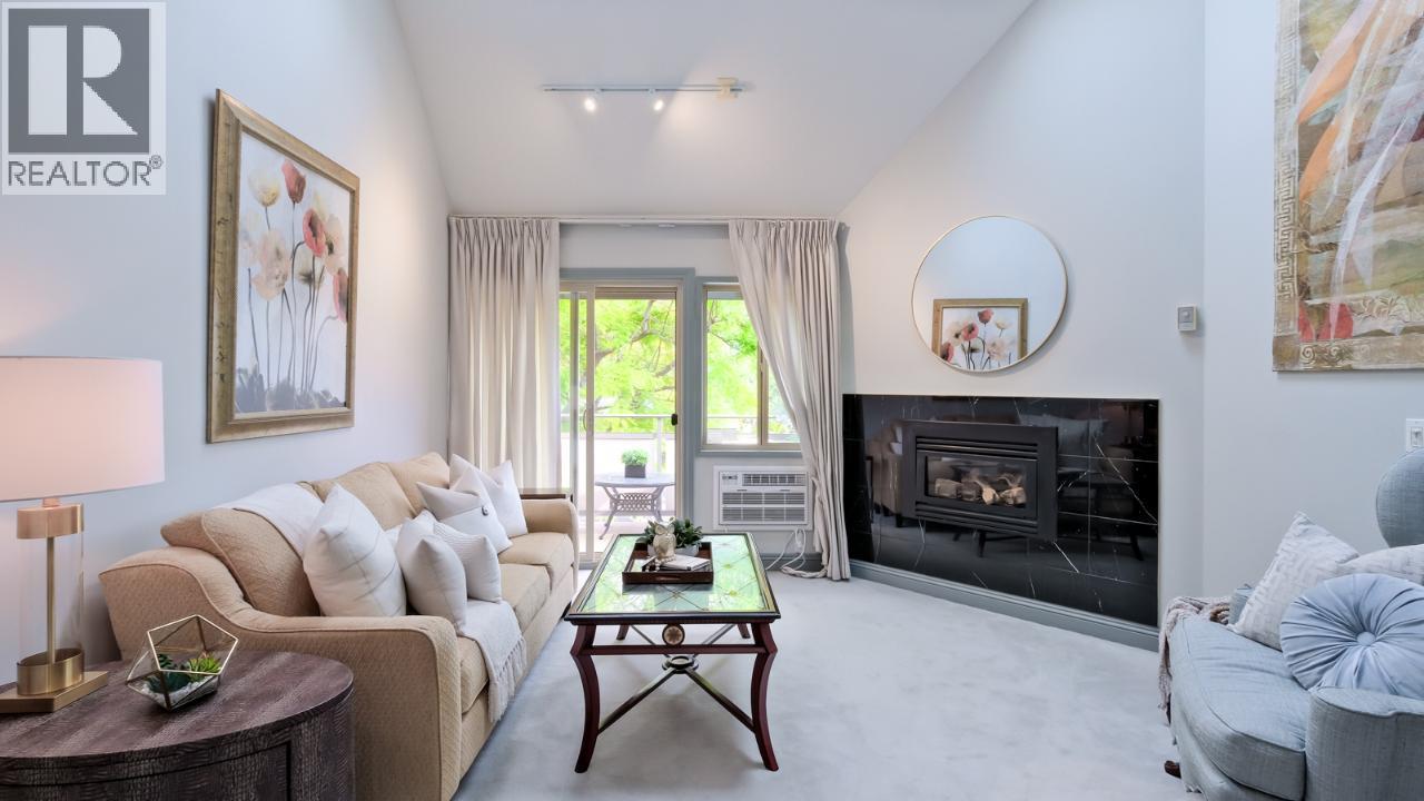 335 Churchill Avenue Unit# 205, Penticton, BC - Indoor Photo Showing Living Room With Fireplace