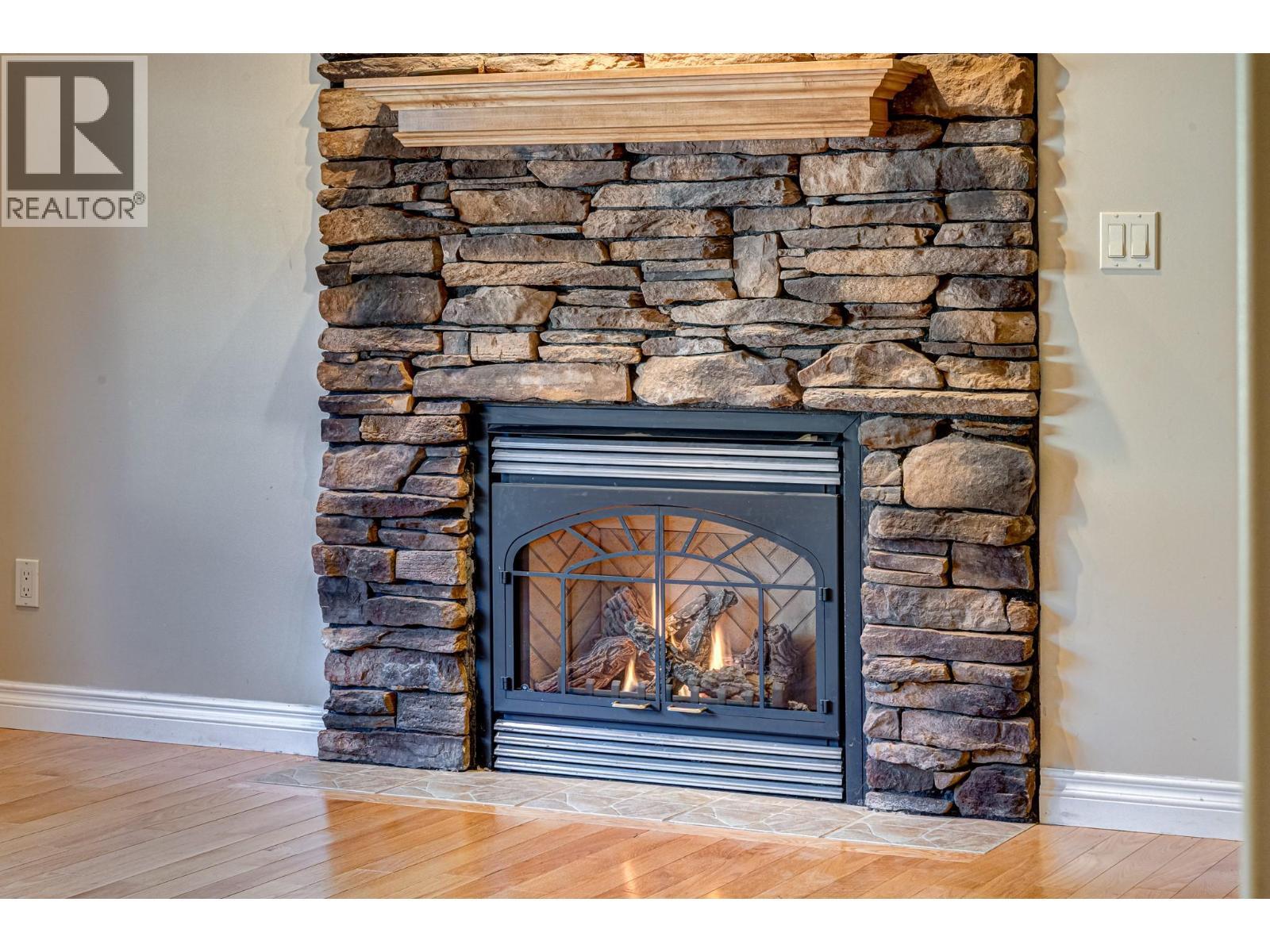 5 Caledonia Place, Elkford, BC - Indoor Photo Showing Living Room With Fireplace