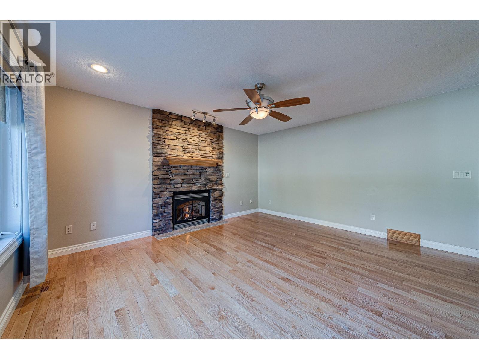 5 Caledonia Place, Elkford, BC - Indoor Photo Showing Living Room With Fireplace