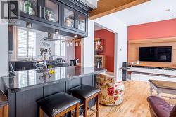 Bar overlooking kitchen, dining & living spaces -