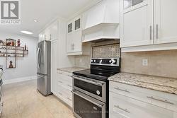 Stunning Gourmet Kitchen Features S/S Appliances -