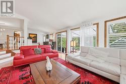 Walkout to Three-Season Sunroom from Family Room -