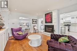 Living Room with Hardwood Flooring & Gas Fireplace -