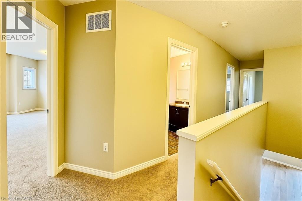 Corridor with an upstairs landing and light colored carpet - 6 Upper Mercer Street Unit# B6, Kitchener, ON - Indoor Photo Showing Other Room
