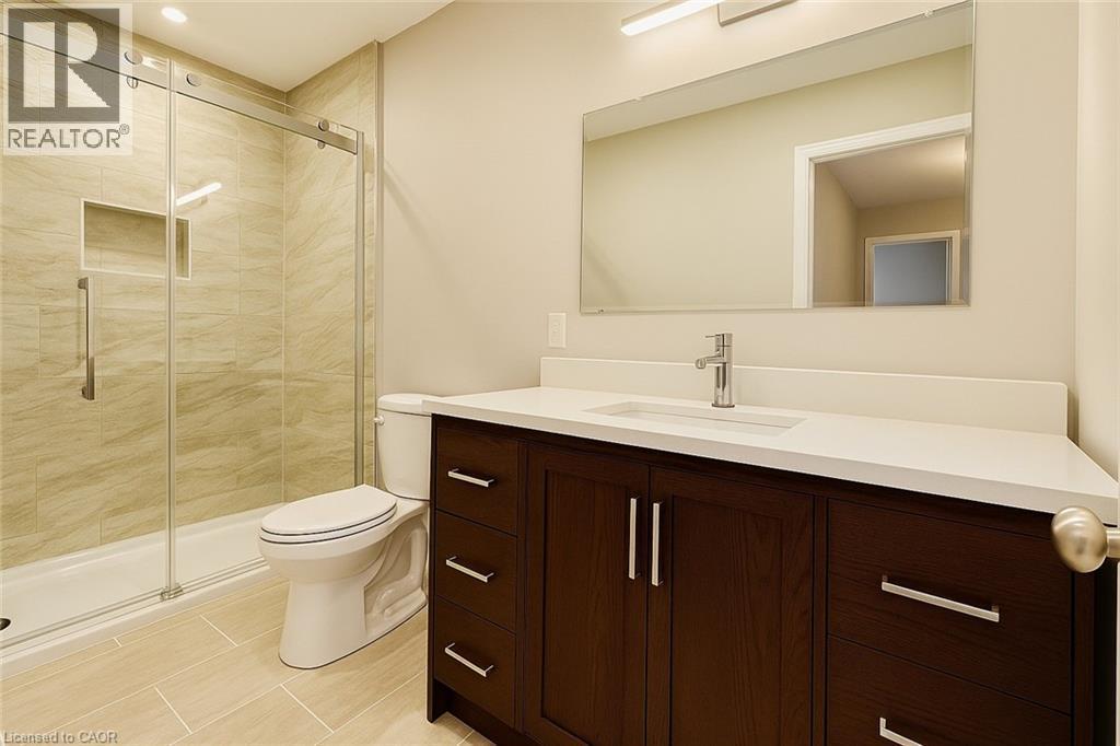 Bathroom featuring vanity and a shower stall - 6 Upper Mercer Street Unit# B6, Kitchener, ON - Indoor Photo Showing Bathroom