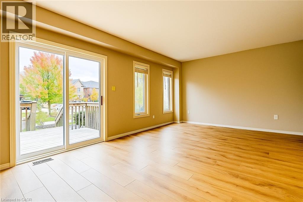 Unfurnished room featuring baseboards and light wood-type flooring - 6 Upper Mercer Street Unit# B6, Kitchener, ON - Indoor Photo Showing Other Room