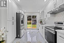 Gorgeous new cabinets, countertops and backsplash. -