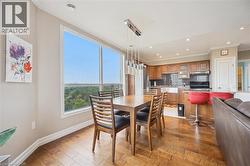 Dining room featuring ornamental molding, light wood-style floors, and recessed lighting -