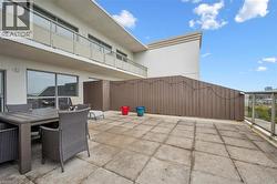 View of patio with outdoor dining area -