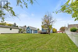 Back view of house, garage and yard -