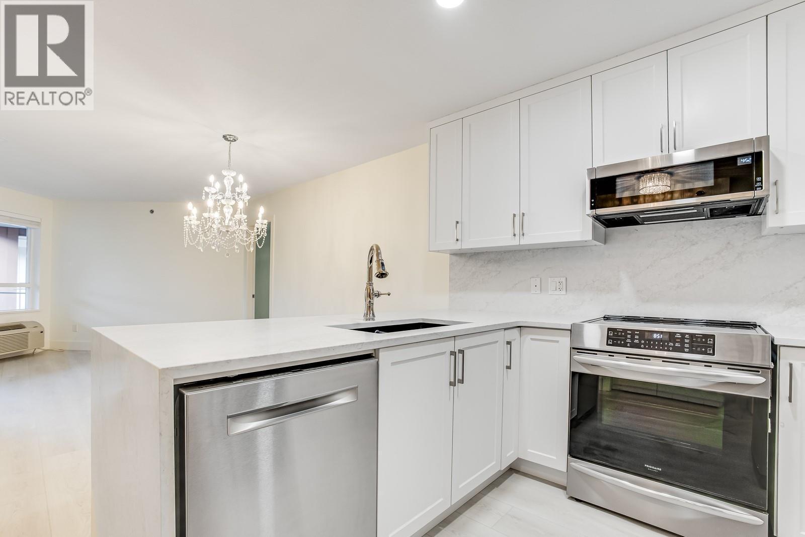 Bright finishings compared to the original units - 1099 Sunset Drive Unit# 432, Kelowna, BC - Indoor Photo Showing Kitchen