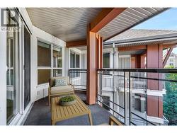 Generous sized patio looking into trees *virtually staged* -