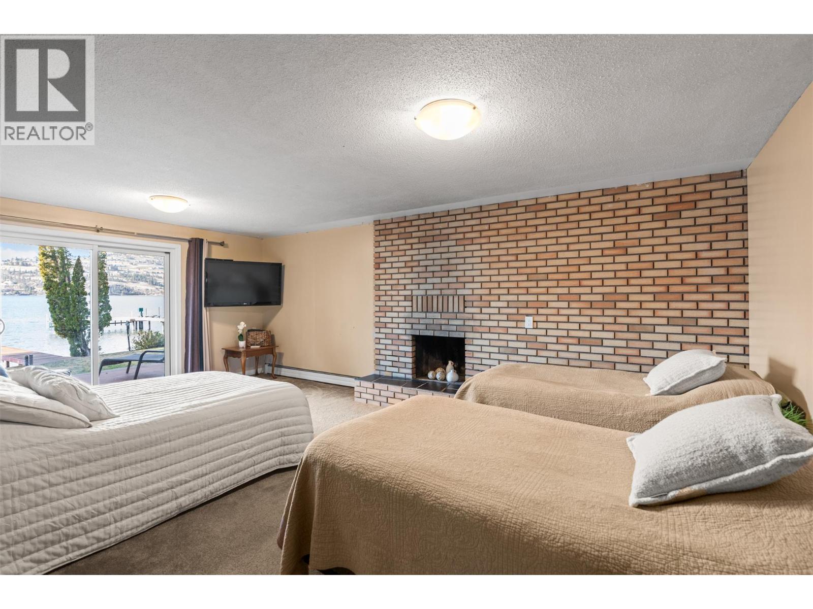 Living/Media Room in Walk Out Basement Used as Additional Bedroom - 8997 Peters Road, Vernon, BC - Indoor Photo Showing Bedroom