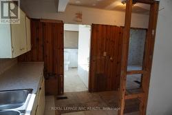 Kitchen w/view into 4 Piece Bath -