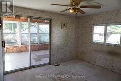 Main Floor Bedroom w/sliding doors to Sunroom -