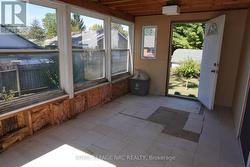 Sunroom w/back/side entrance to Back Yard -