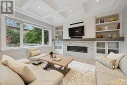 Family Room w/Gas Fireplace & BI Display Cabinetry -