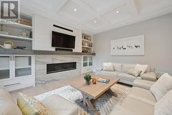 Family Room w/Gas Fireplace & BI Display Cabinetry -